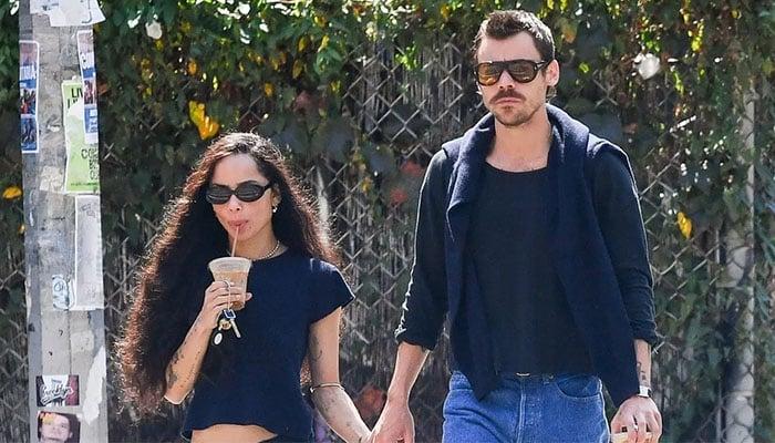 Harry Styles and Zoe Kravitz walking together during a public appearance